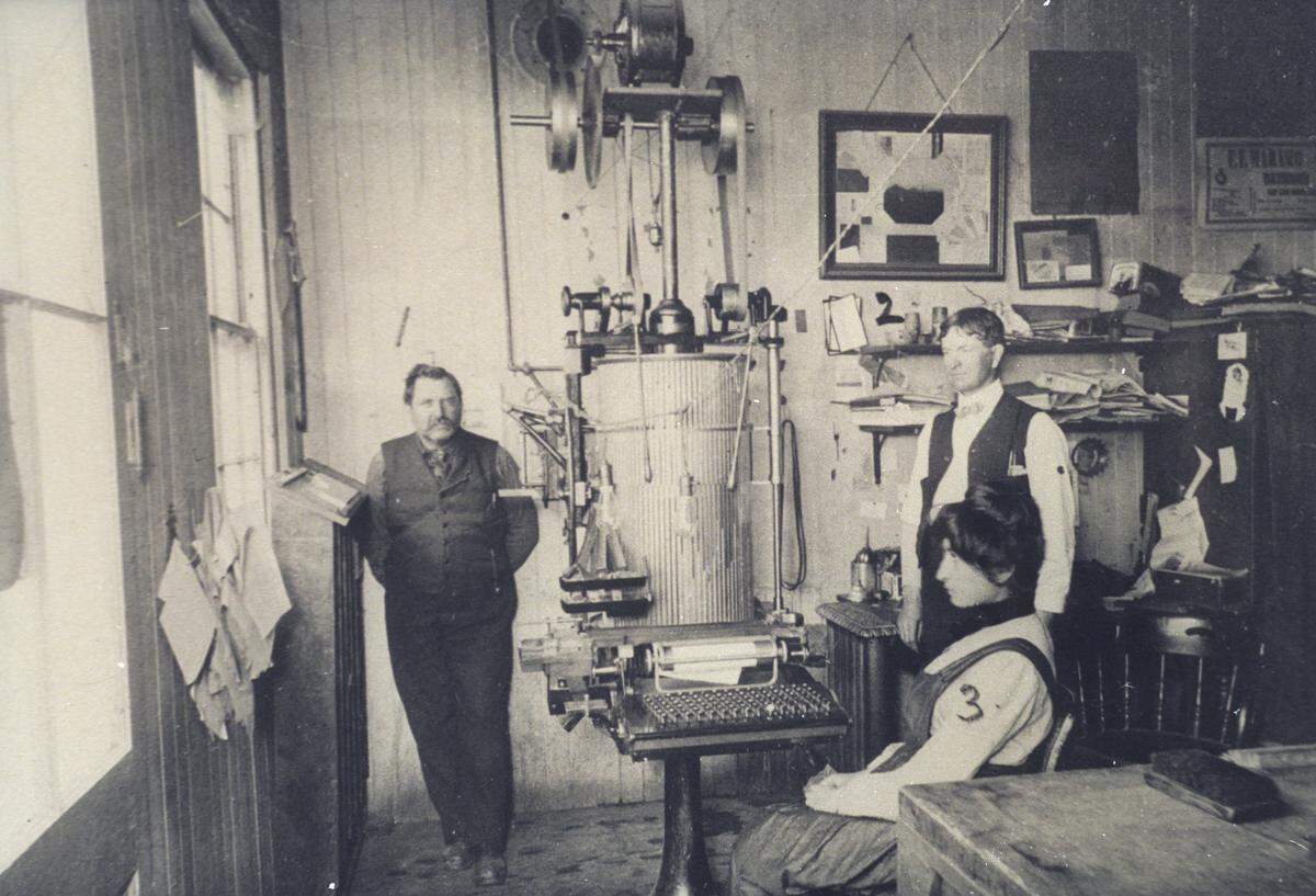 This was the first typesetting machine brought to San Luis Obispo by The Tribune. It was called a Simplex and was the forerunner of today’s vastly complicated type casting machines. Left to right are Richard Leland, E.W. Lawrence and Juantia Herrera.