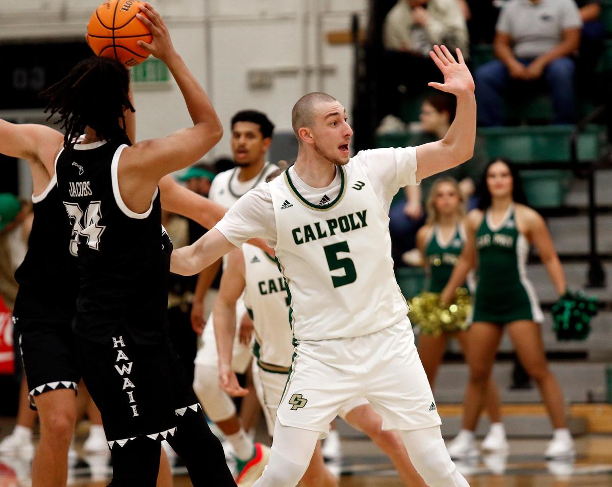 Guzman Vasilic defends against the Rainbow Warriors. Cal Poly beat Hawaii 79-63 in a men’s basketball game at Mott Athletic Center in San Luis Obispo on Thursday, Feb. 6, 2025.