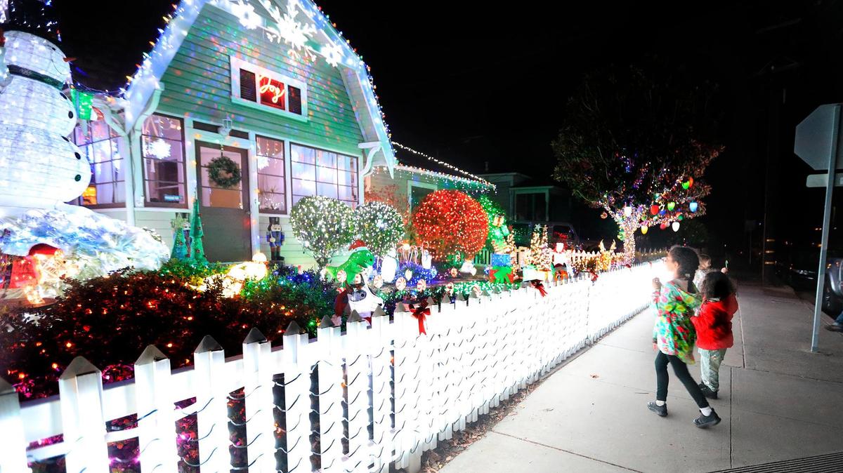 The Terry home on Chorro and Upham St., in San Luis Obispo is a local favorite. Salah Rohde, 6, and her sister Sanaa, 3, San Luis Obispo squeal with delight at the delightfully decorated house.