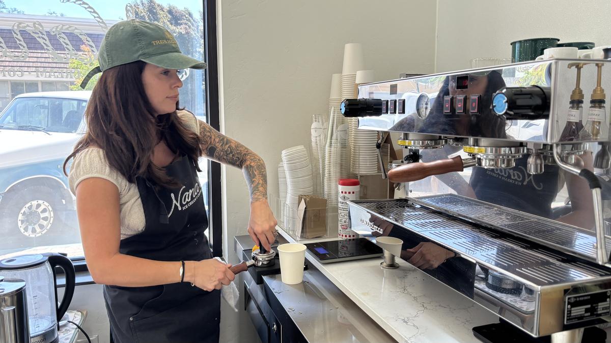Amanda Torres, owner of Tres Hermanos Coffee, makes a traditional Tres Hermanos latte with condensed milk and spices at Nana’s Ice Cream & Coffee in Atascadero.
