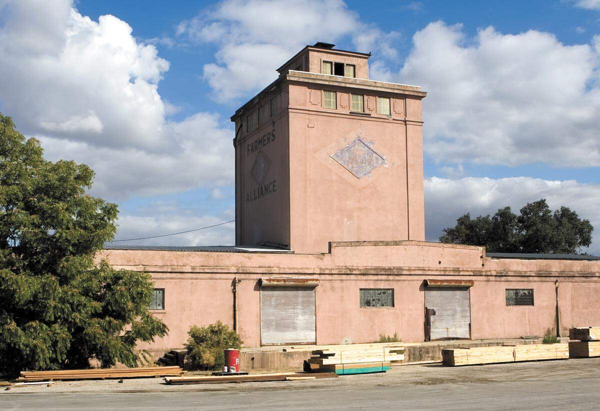 According to a Paso Robles Pioneer Museum display, the Farmers Alliance building was built as an almond warehouse in 1922 and located near the railroad for convenient shipping. It’s seen here before its restoration by Derby Wine Estates in 2014.