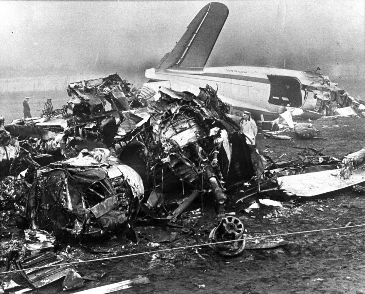 Sixteen Mustang football players, the student manager, a member of the Mustang Booster Club and four others perished that October 29, 1960. Of the 48 persons aboard the Curtiss C-46 aircraft, another 22 were injured, some gravely. Dense fog, later determined to be a major factor in the accident, slowed ambulances trying to reach the airport 20 miles east of Toledo. Photo courtesy the Toledo Blade.