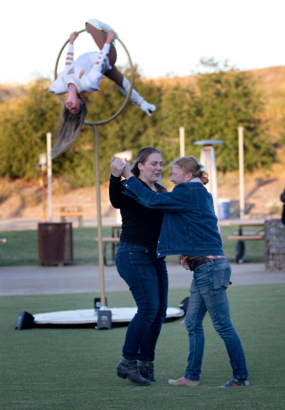 Sensorio in Paso Robles held its fifth anniversary Illumination Gala on Thursday, May 23, 2024. A couple dance to live music in the new outdoor dining area with an aerial performer behind them.