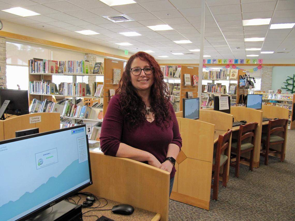 Destiny Johnson, library branch manager of the Cambria Public Library, poses for a photo. The library service in the small coastal town is celebrating its centennial year.