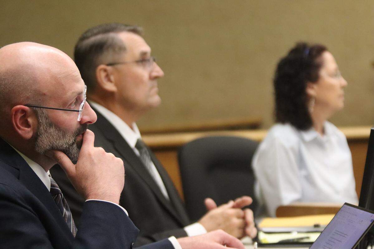 Deputy District Attorney Ben Blumenthal, left, District Attorney Investigator Fred Phlum and Gaea Powell, seen here in court during Powell’s preliminary hearing on April 1, 2026. Powell is charged with nine counts of election fraud.