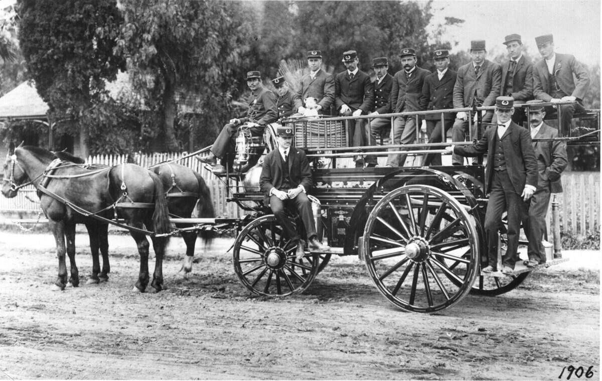 CHEMICAL TRUCK - The latest thing in fire fighting equipment - in 1906, that is-is pictured here in a photo which was presented to the San Luis Obispo fire department by Mrs. Callie M. John in 1948. The gallant volunteers in uniform are as follows: Top row, left to right-Charles Hasse, John Isola, Manuel Lopez, Billie Bambrouck, John Kirkeby, Johnnie Martin, a Mr. Parsons, Henry Berkemeyer, Frank Tercis and Warren M. John. Lower row same order, Frank Soto, Ernest Taylor and Joe Ghigliotti. Volunteer fire companies took great pride in their appearance and equipment.