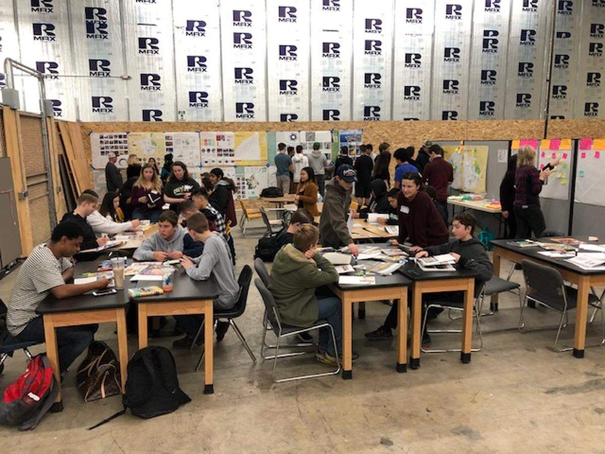 Cal Poly students meet with Paradise High School students in a temporary school in Chico during Cal Poly’s trip to Butte County in January.
