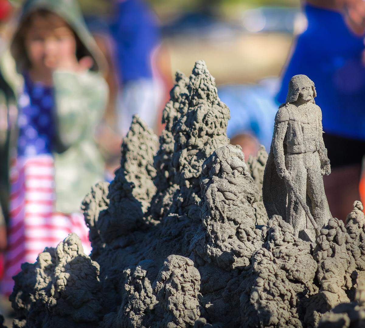 A drip sand sculpture featuring figurines like Darth Vader was one of the top two entries in Cayucos’ Fourth of July sandcastle-building contest on July 4, 2022.