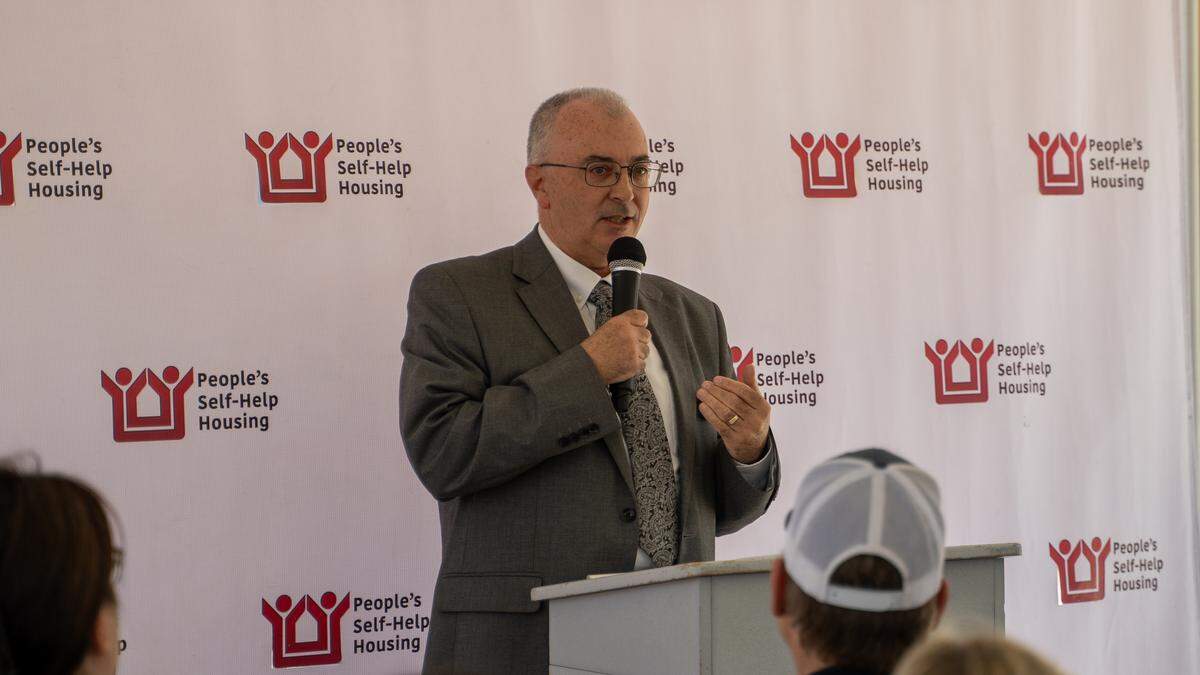 People's Self-Help Housing CEO Ken Triguiero speaks at the grand opening of Cleaver & Clark Commons in Grover Beach on Wednesday, May 20, 2026. The first People's Self-Help Housing project in Grover Beach features 53 affordable units, with an emphasis on formerly homeless individuals and farmworker families.