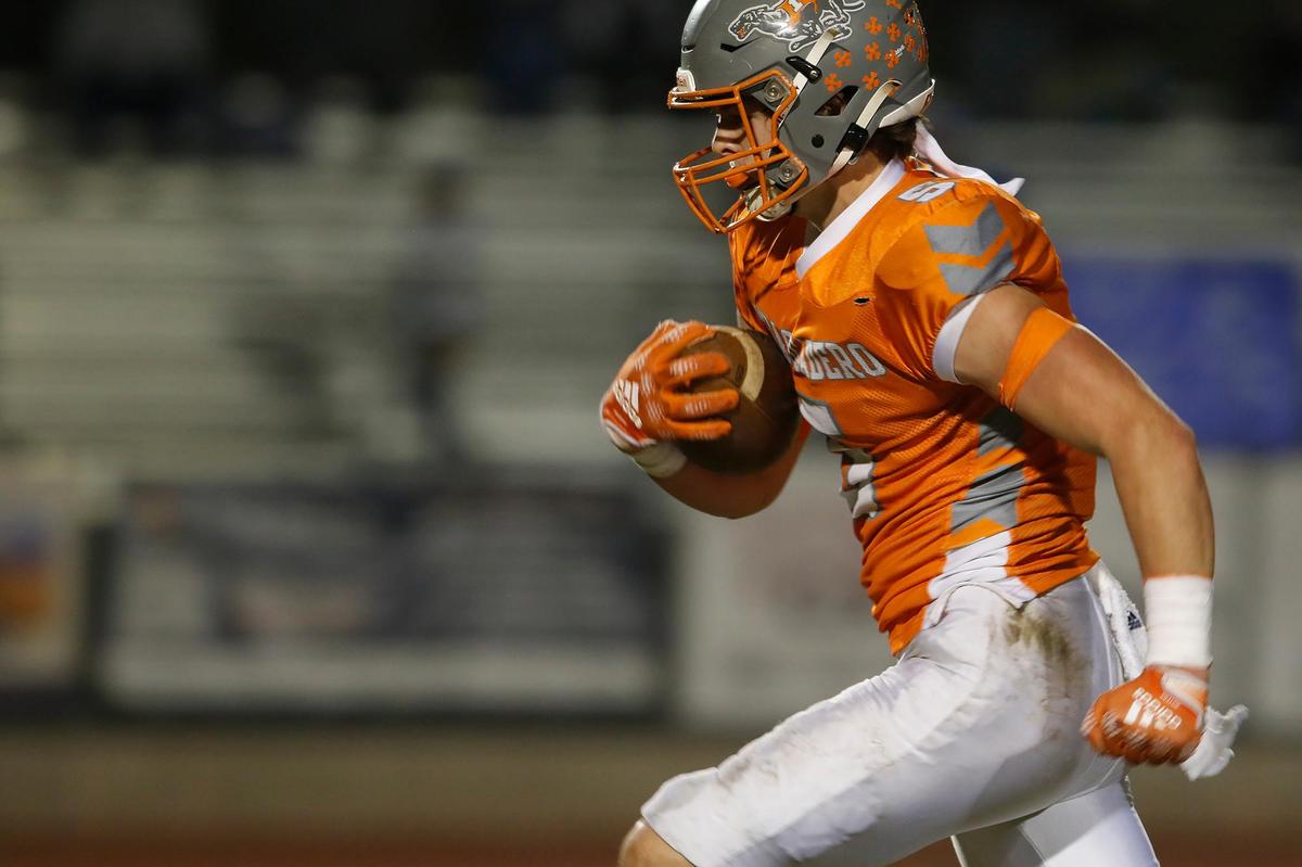 Greyhound linebacker Dallas Parish (5) en route to the end zone for a touchdown. Atascadero High School Greyhounds beat Dos Palos Broncos 35-0 in the prep football semifinals, Friday, Nov. 18, 2022.