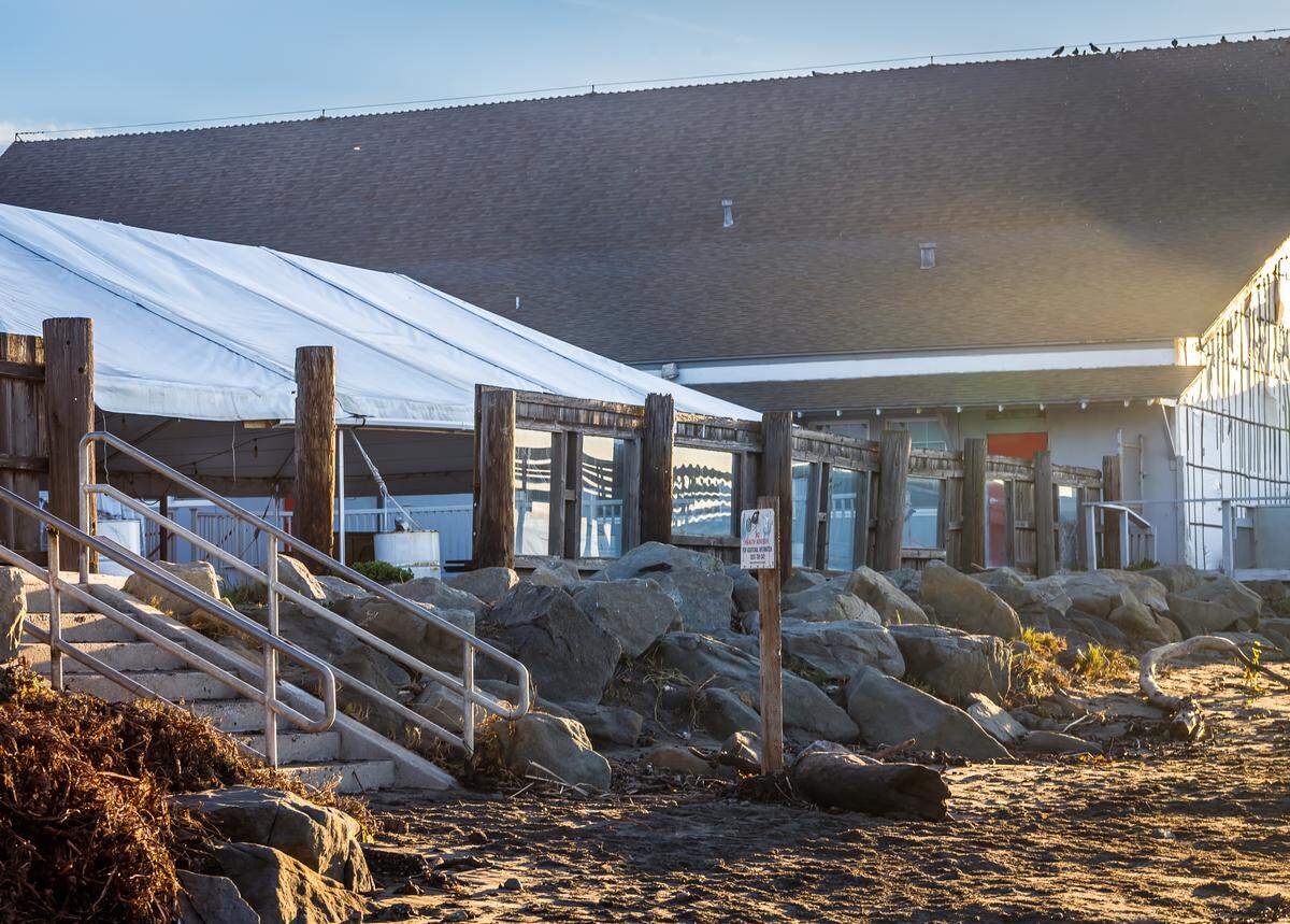 High tide and surf damaged part of a wall at the Veteran’s Hall in Cayucos on Wednesday.