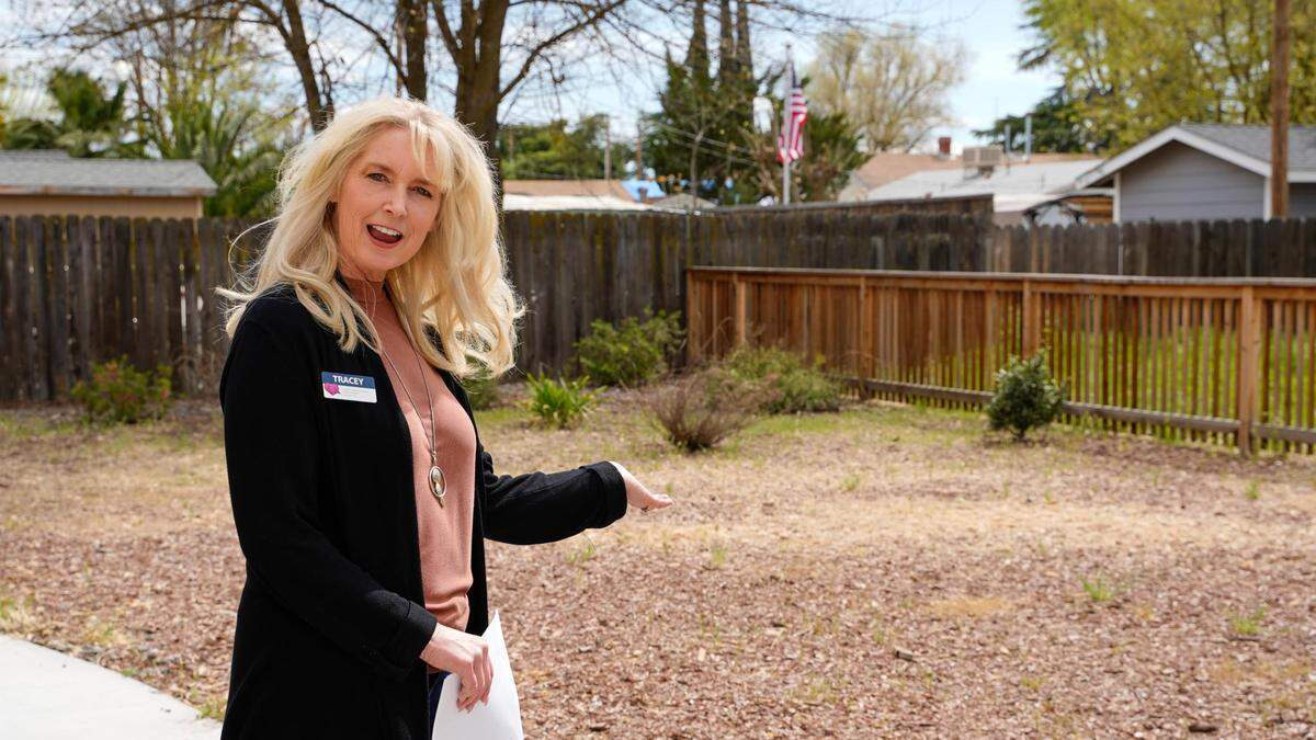 Shandon Library branch manager Tracey Montelongo stands outside the library in the spot where a community garden will be built using the library’s new Tool Lending Library. More than 50 different types of tools are available to card holders.