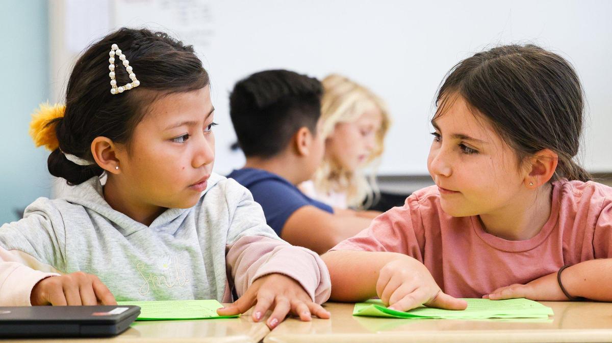 From the left, Carrisa Plains Elementary School third-graders Lilibeth Romero Sanchez and McKinley Twisselman partner read, taking turns speaking sentences.