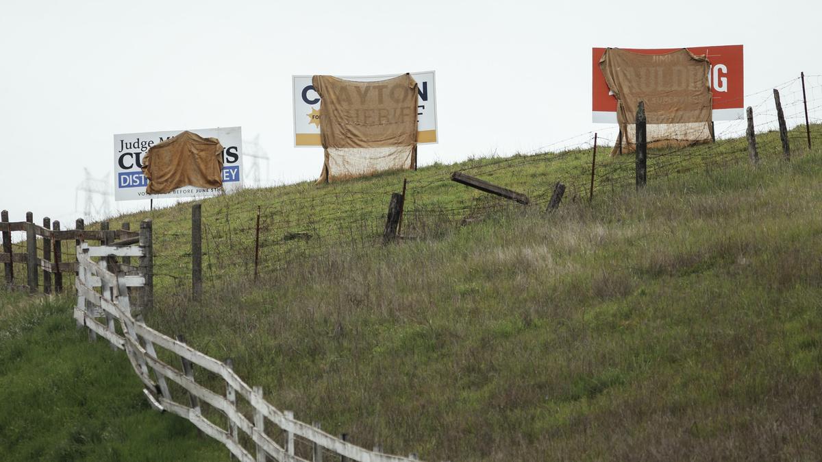Campaign signs are covered along on Hwy. 227 across from the Cold Canyon Landfill.