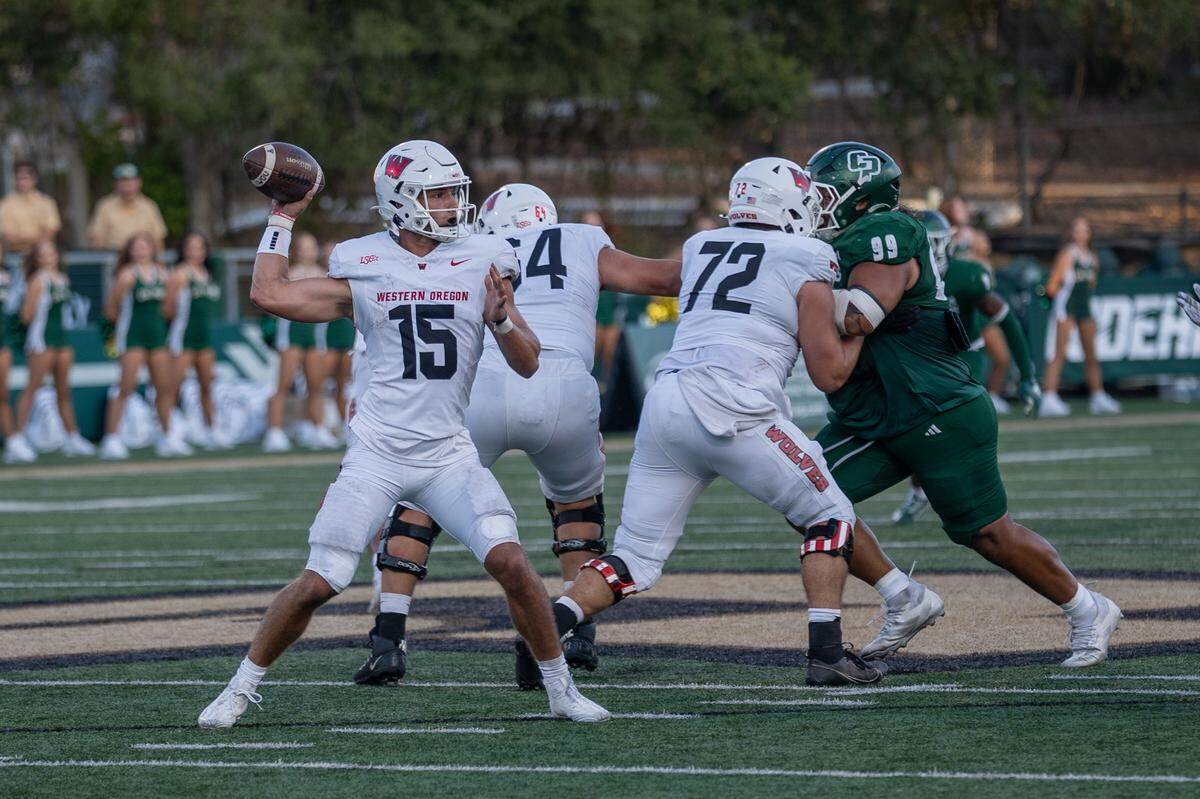Western Oregon quarterback Jordan McCarty drops back to pass in the first half on Saturday, Sept. 13, 2025. The Mustangs defeated the Wolves in a 56-7 rout at home.