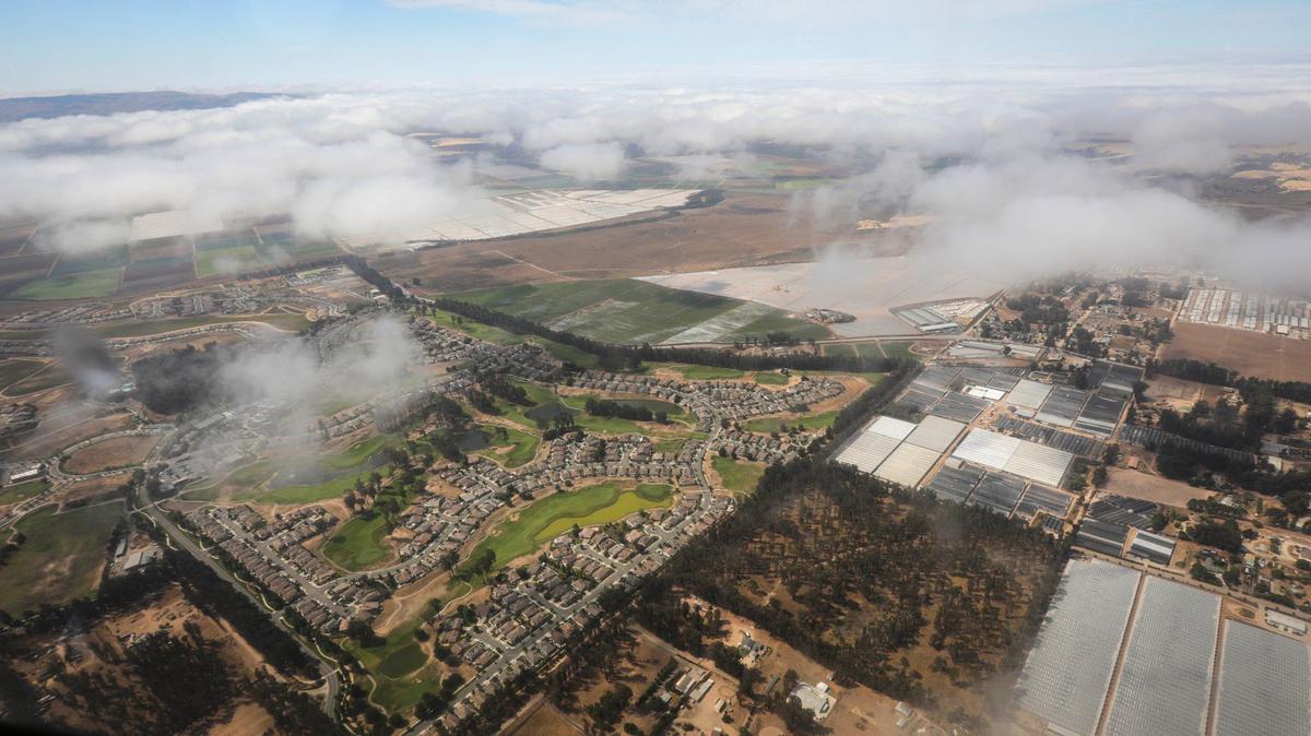 Fog breaks over the Monarch Dunes Golf Club in the Nipomo area.