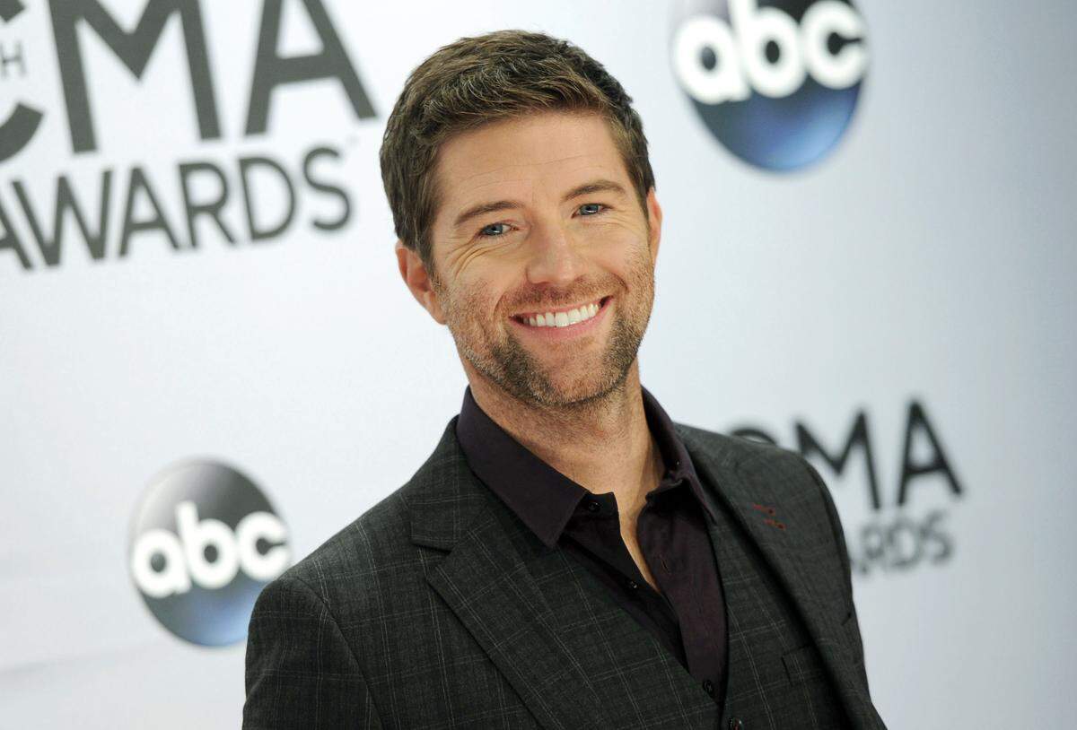 In this Nov. 5, 2014, file photo, Josh Turner arrives at the 48th annual CMA Awards at the Bridgestone Arena, in Nashville, Tenn. A passenger bus crashed in September 2019 on eastbound Highway 46 near Shandon while carrying the road crew for the country and gospel singer.