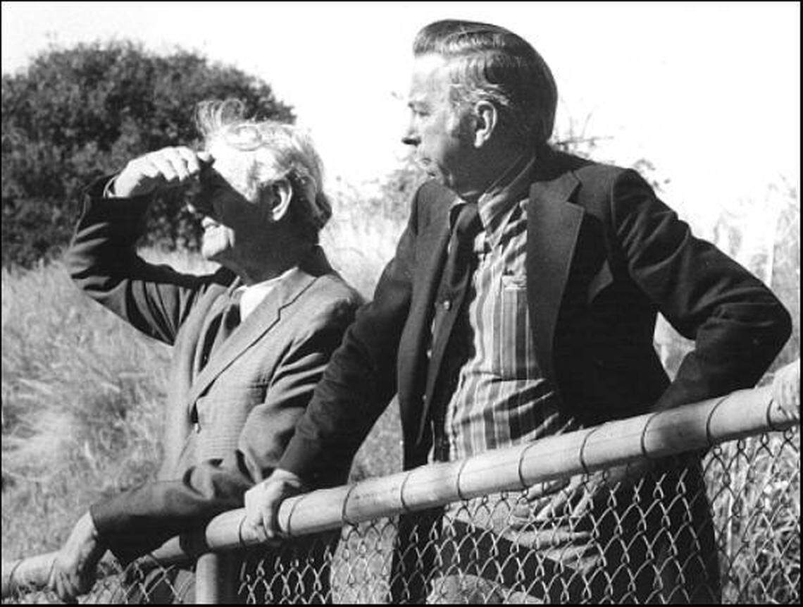 Councilman Myron Graham, left, and Mayor Kenneth Schwartz survey city creeks to improve drainage in 1973.