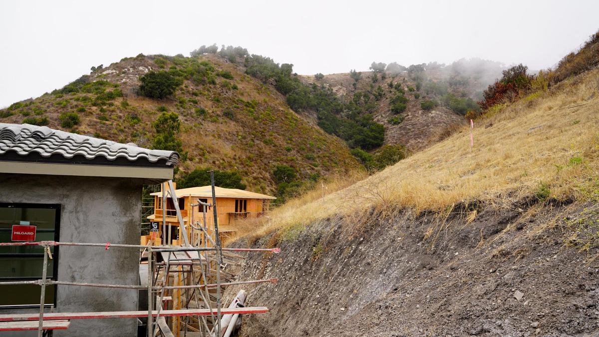 Several three-story homes in the Barcelona Point are set into the landscape of the mountains that border Pismo Beach to the east, pictured here Tuesday, July 1, 2025. The development is nestled into the base of the mountains that border Pismo Beach to the east, requiring some home lots to be leveled and reinforced prior to building.