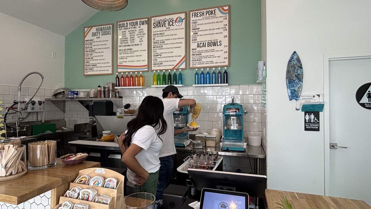 Co-owner of Kai Shave Ice in Morro Bay Hector De La Fuente makes a mango shave ice bowl with fresh mango, seen here on July 1, 2026.