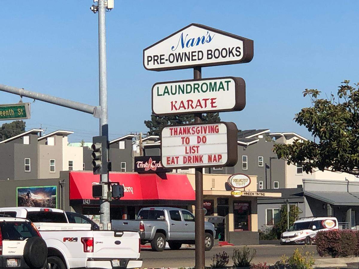 A sign below Nan’s Pre-Owned Books in Grover Beach.