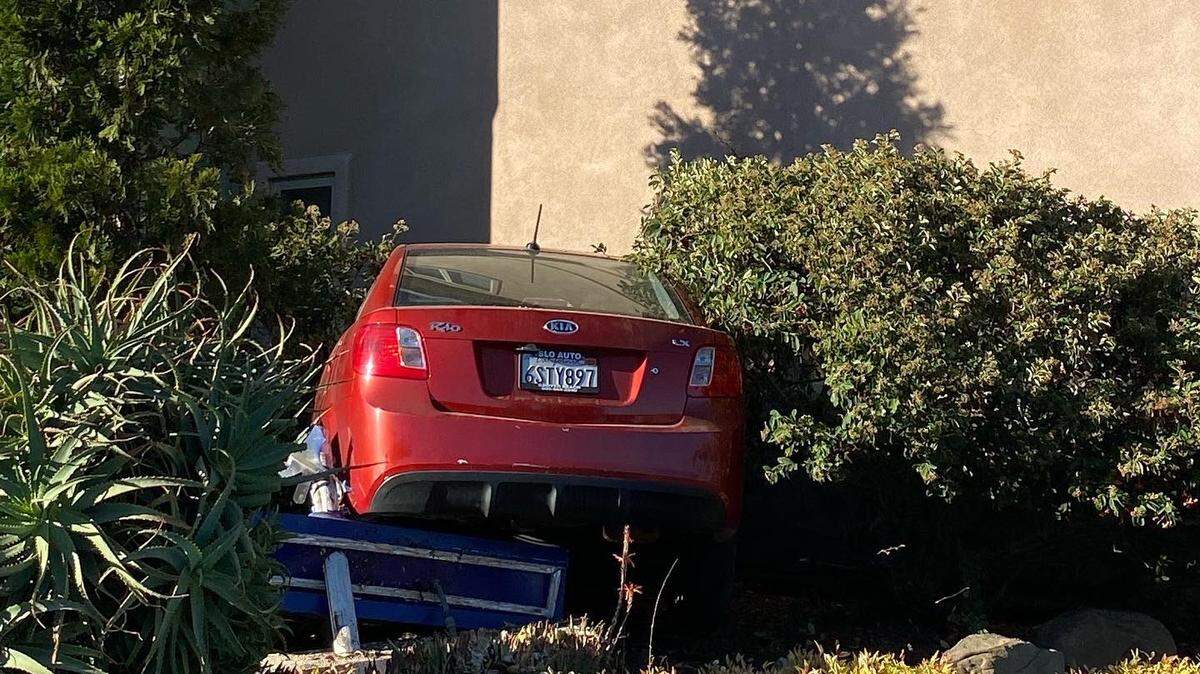 A red KIA crashed into the shrubs on Broad Street in San Luis Obispo, California on July 12, 2022. No one was injured.