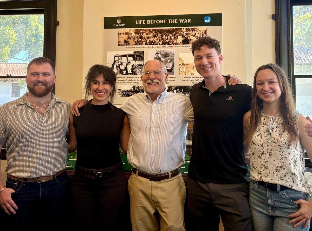 From left, Cal Poly students Collin Marfia, Annie Pagel, professor Terry Jones, and students Jesse Horsely and Emma Bowman stand in the History Museum of San Luis Obispo County to celebrate the debut of their “A Dream Interrupted” exhibit on May 30, 2025. The exhibit features artifacts discovered decades after the Yoshida family was forcibly relocated to an internment camp from their homestead near Montaña de Oro State Park.