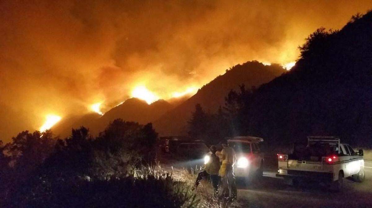 Flames from the Dolan Fire burn a hillside near Big Sur.