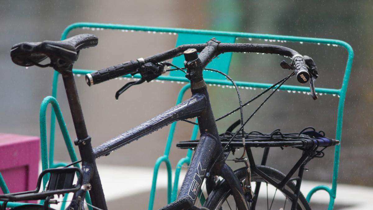 A bicycle on Marsh Street in San Luis Obispo drips with rain on Monday, Nov. 7, 2022.