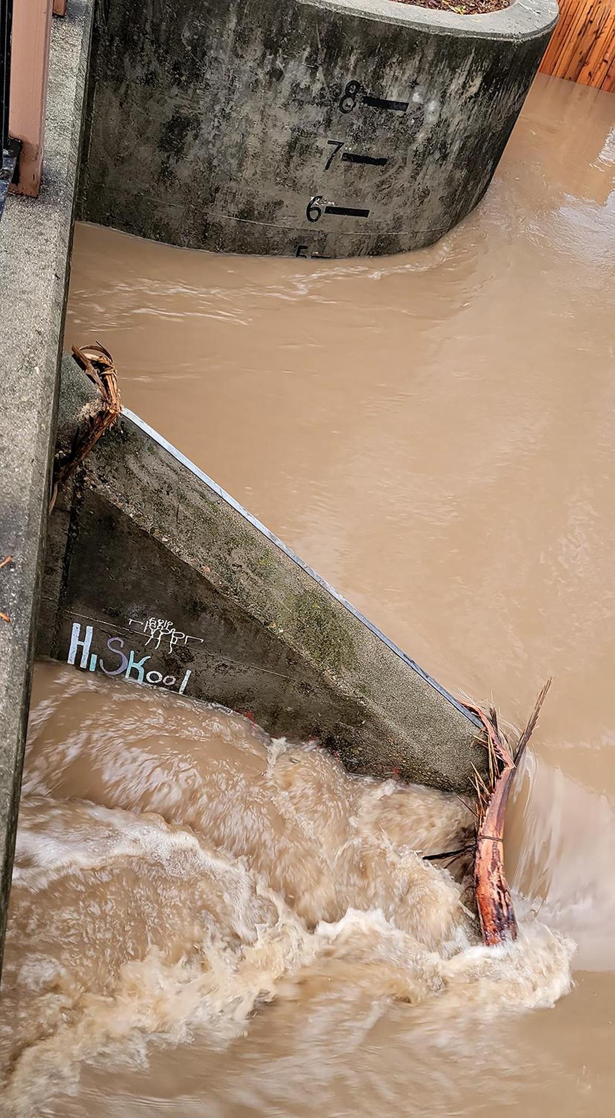 A culvert under Madonna Road in San Luis Obispo says the drainage level is 5 feet on Tuesday, Jan. 10, 2023.