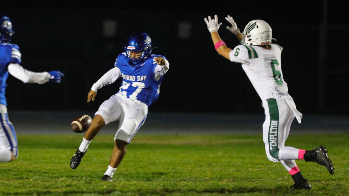 A.J. Alvarez punts for the Pirates. Templeton beat Morro Bay 27-9 in an Ocean League football game on Oct. 21, 2022.