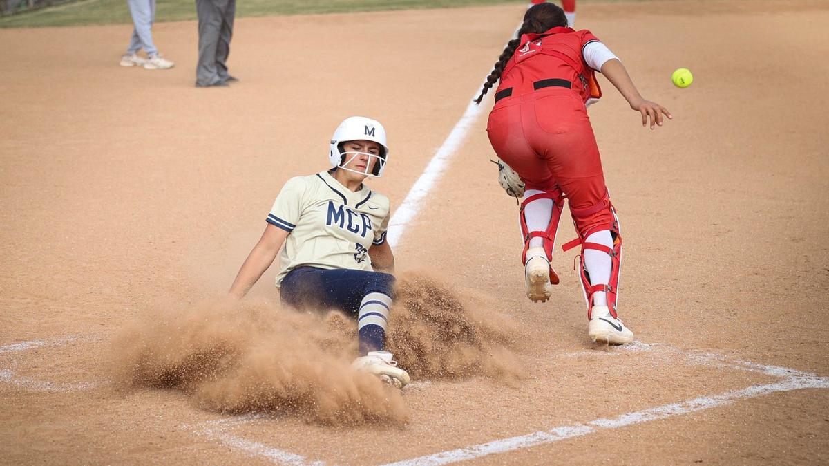 Landrie Hinrichs scores the first run of the game as catcher Jaymee Hick fields the throw. Mission Prep won 2-0 over Kerman in a softball playoff May 22, 2024.