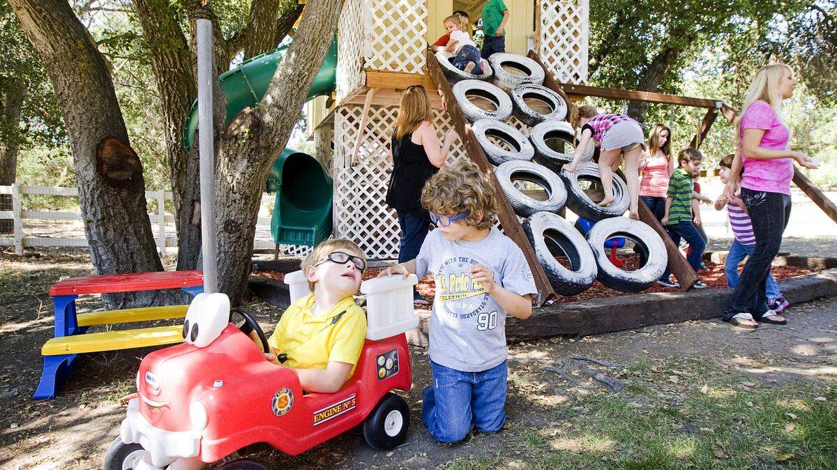 A group of mothers and their children, some with special needs, play in the Atascadero backyard of Jenell Allen, right. Her group is working to build an all-inclusive park near the Colony Park Community Center.