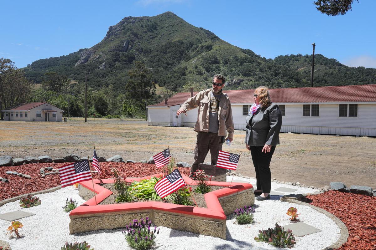 Andy Rogers, left, and Leslie Lechner talk about restoration efforts on a 1951 memorial honoring Iwo Jima soldiers that had been buried for decades before being unearthed by a Camp San Luis Obispo employee. The site was rebuilt and restored by the La Cuesta Chapter Daughters of the American Revolution.
