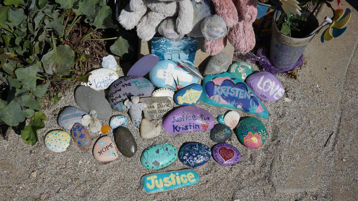 Painted rocks sit at a memorial for Kristin Smart near Dinosaur Caves in Pismo Beach.