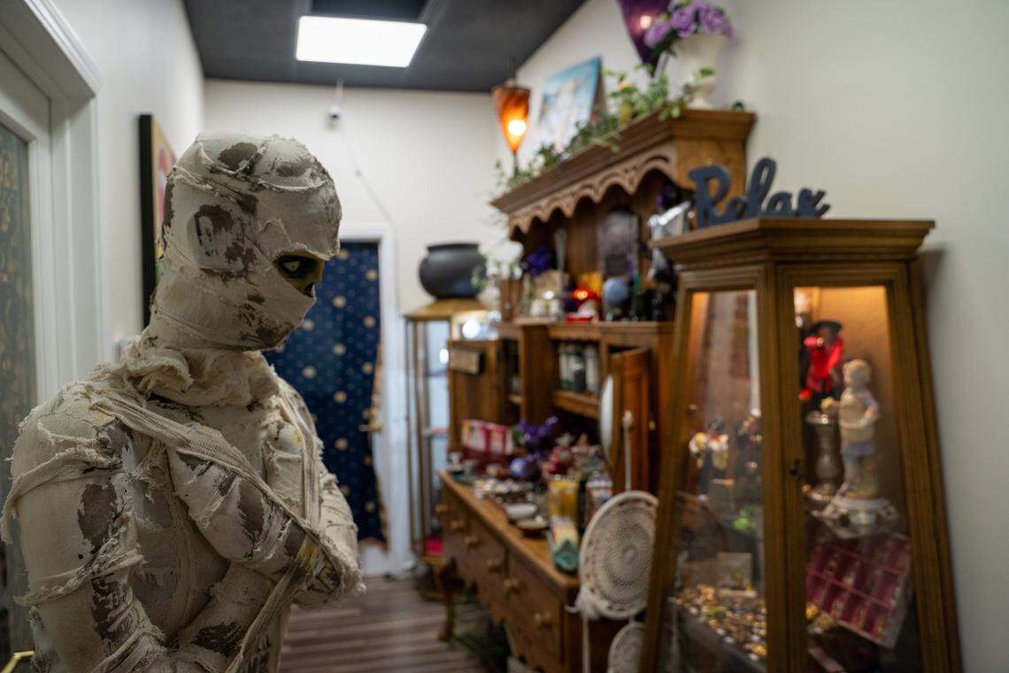 A mummy stands watch near a display of antiques at Odd Fellows Antiques Emporium A room themed around Alice in Wonderland and dark gothic antiques is part of the new home of Odd Fellows Antiques Emporium in Grover Beach, pictured here on Tuesday, Nov. 11, 2025. The antique store moved to 1527 W Grand Ave. in August after its 983 W Grand Ave. home was sold to new owners.