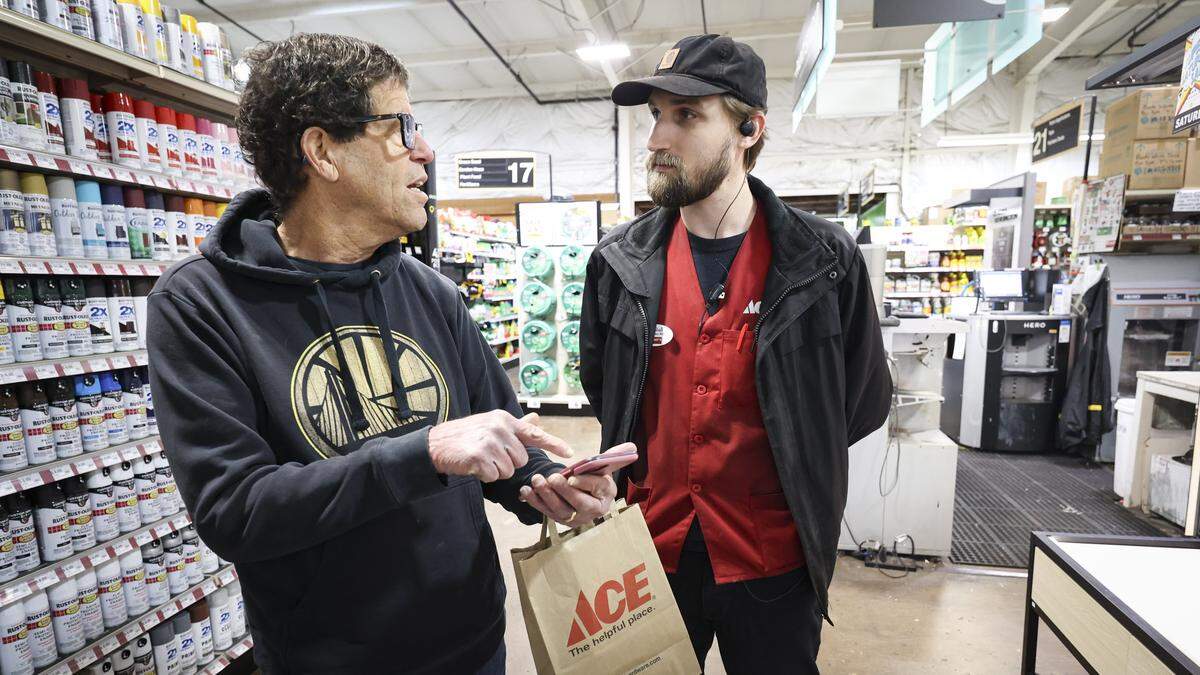 Retired Cal Poly professor Doug Cerf gets advice in the paint department from Marshall Reid the store's paint lead, at the Miner's ACE Hardware store in San Luis Obispo on Feb. 19, 2026.