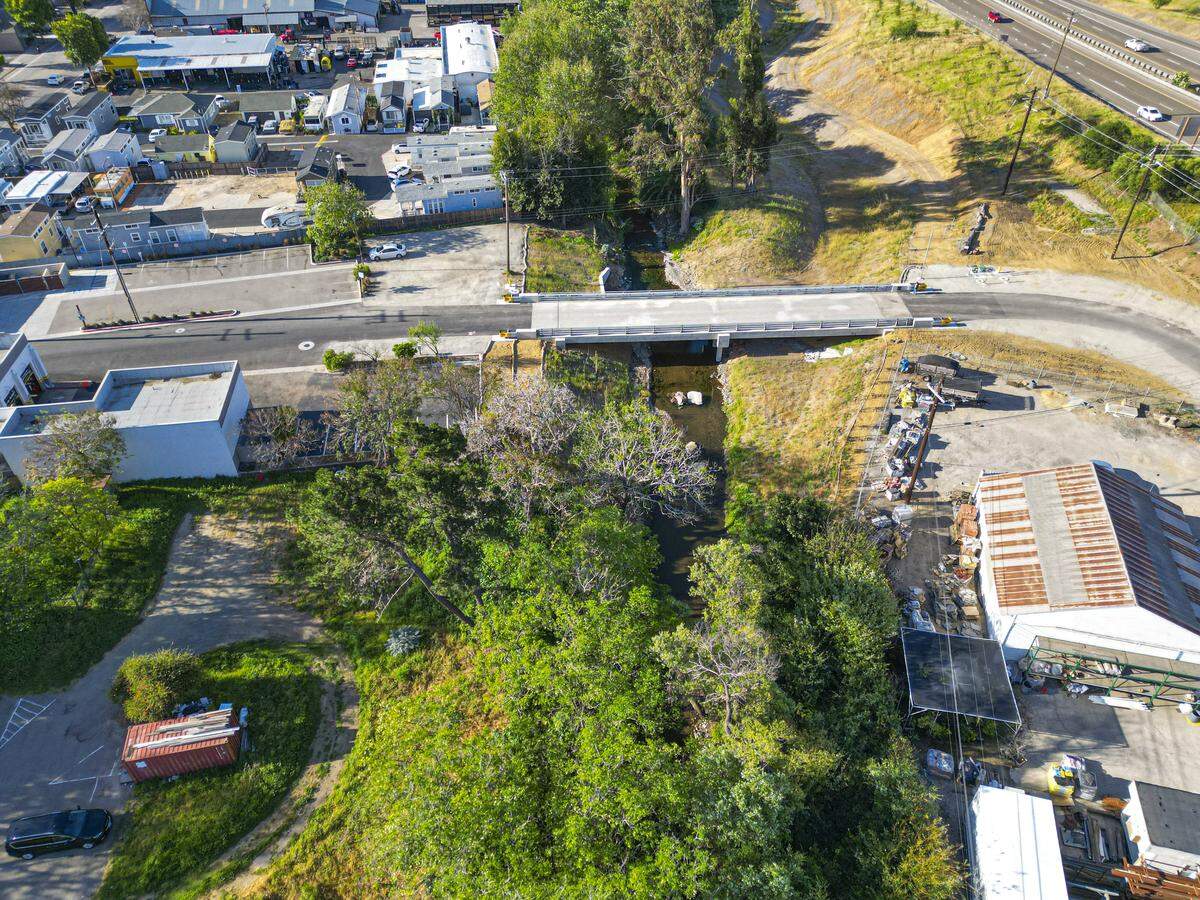 The city of San Luis Obispo replaced the century-old Bianchi Bridge at the end of Bianchi Lane, seen here in 2026. The new bridge is wider, so water can divert into two bypass channels instead of flooding the creek.