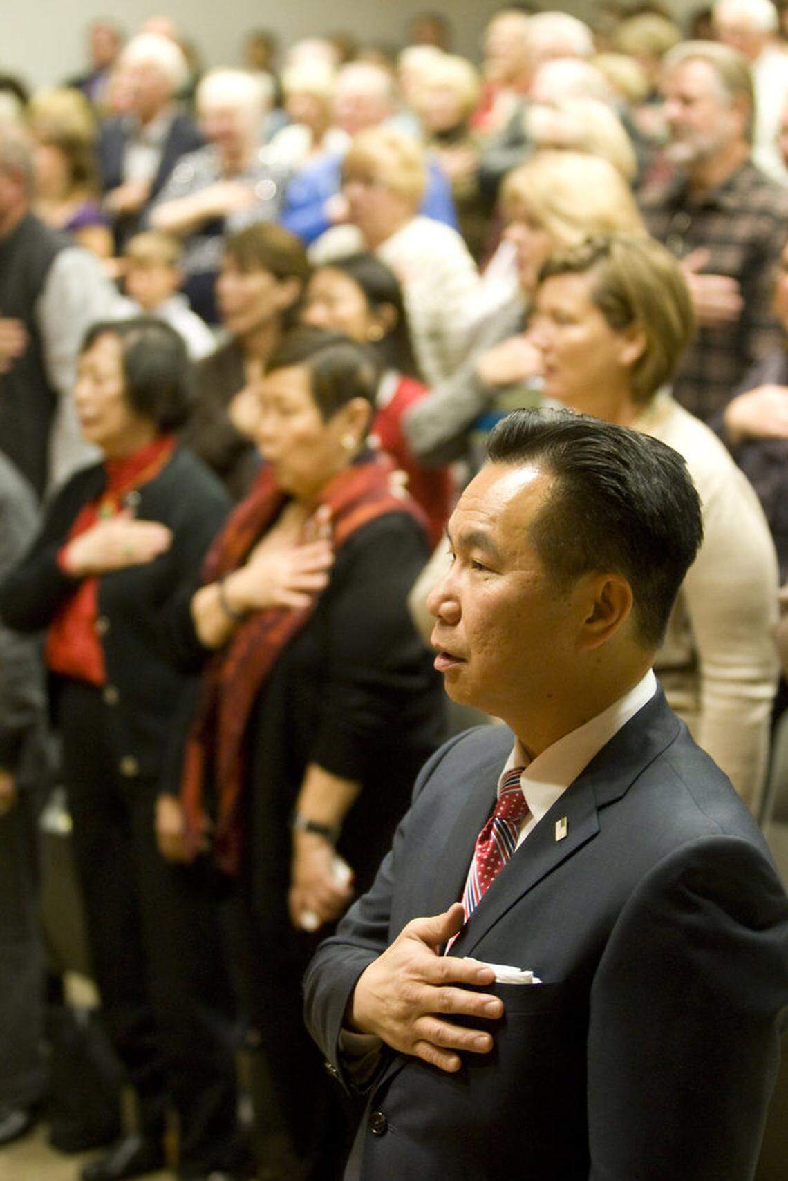 San Luis Obispo County Clerk-Recorder Tommy Gong says the Pledge of Allegiance before being sworn into office in January 2015.