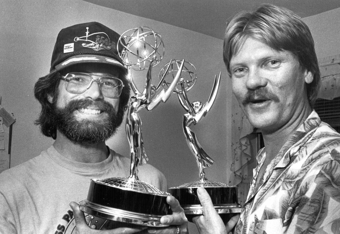 Steve Anderson, left, and Simon Smith hold Emmys they won for the World War II submarine replicas they built for the TV series “War and Remembrance.”