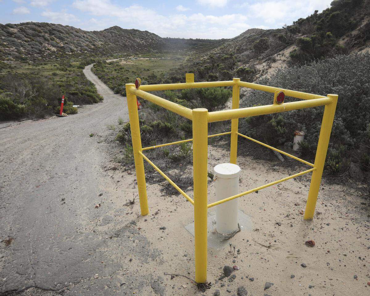 Chevron installed 900 groundwater monitoring wells on the property, one of which is seen here on Oct. 1, 2025. A 30-year cleanup of the former Unocal oil field at the Guadalupe-Nipomo Dunes could be completed during the next five years. Chevron agreed to donate the property to the U.S. Fish and Wildlife Service when the remediation project is complete.