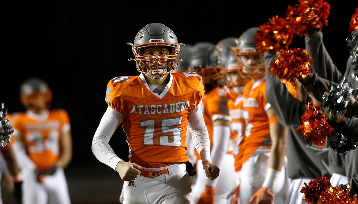 Grey quarterback Kane Cooks (15). Atascadero High School Greyhounds beat Dos Palos Broncos 35-0 in the prep football semi-finals, Friday, Nov. 18, 2022.