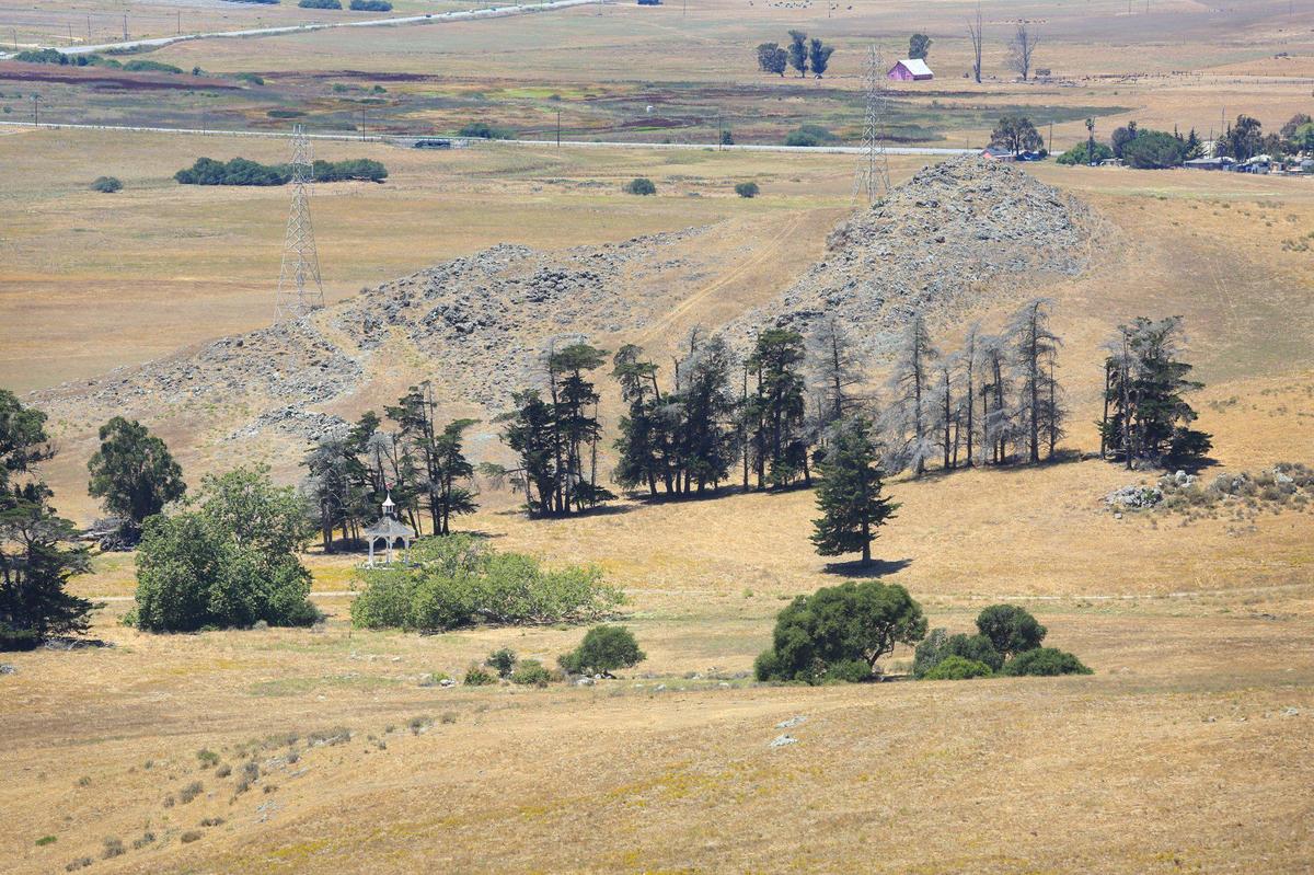 A 360-acre Alberti-Madonna ranch property is listed for sale as ag land, but it suggests it could be rezoned in the future for residential. The property is an L shape at the base of Cerro San Luis to Laguna Lake.