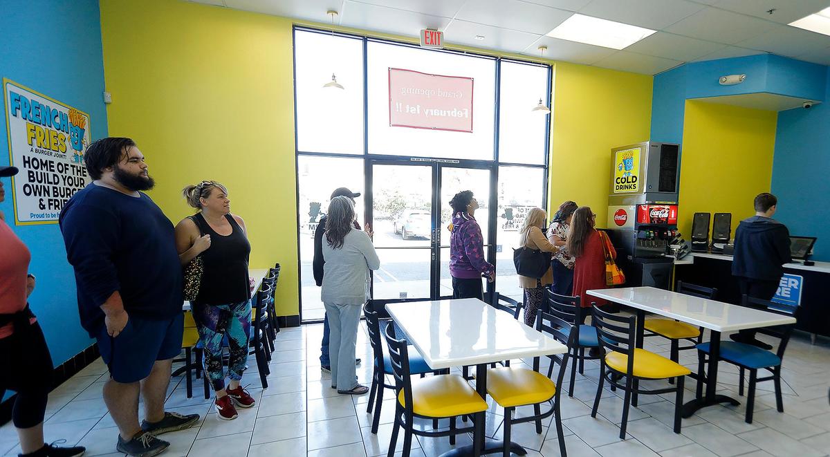 Customers line up at French Fries USA in Arroyo Grande on Feb. 1, 2023.