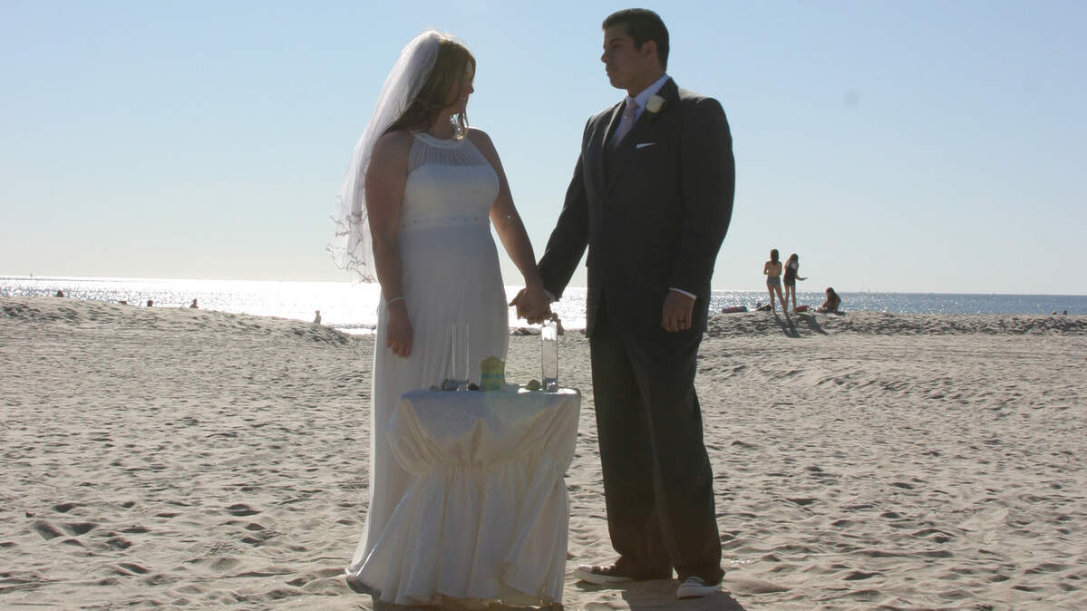 A couple gets married on Central Beach in Coronado, California.