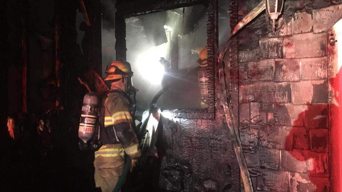 Firefighters battle an early morning fire Tuesday, May 29, 2018, in Cambria's PineKnolls area.