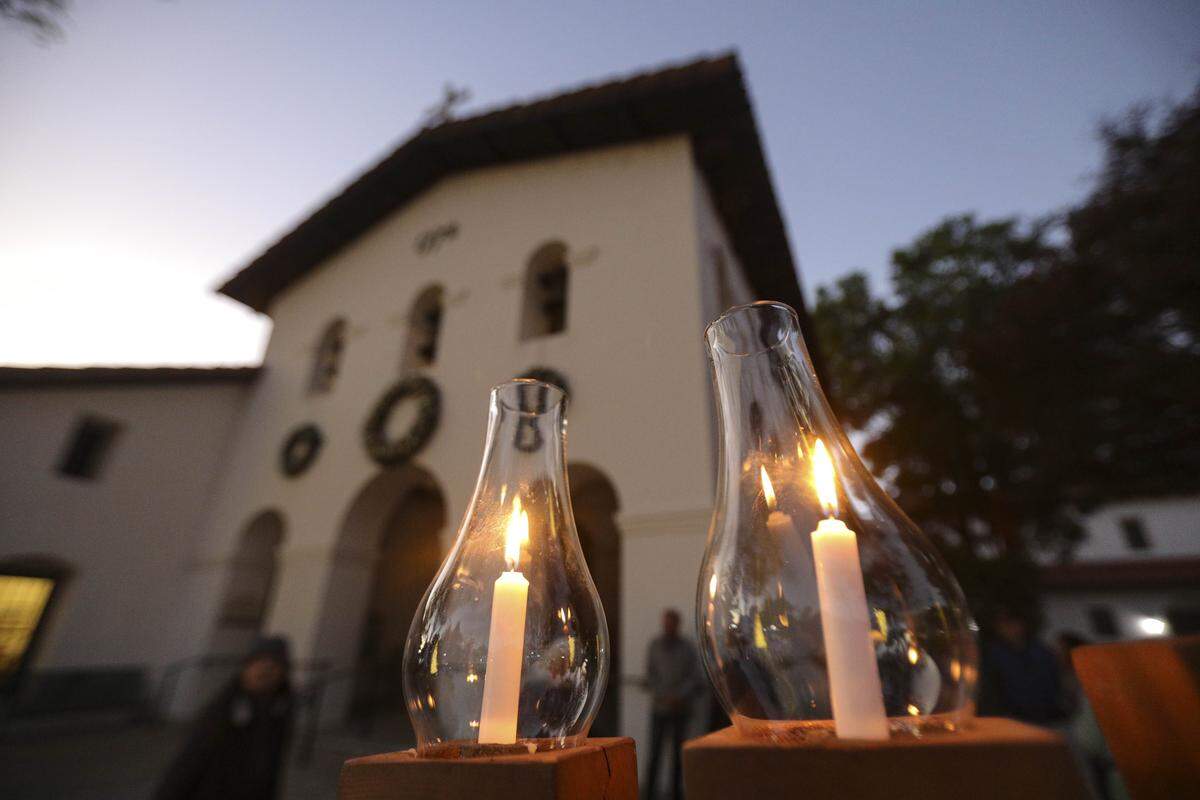 About a dozen people gathered in front of Mission San Luis Obispo to light the menorah on the second night of Hanukkah on Dec. 15, 2025.