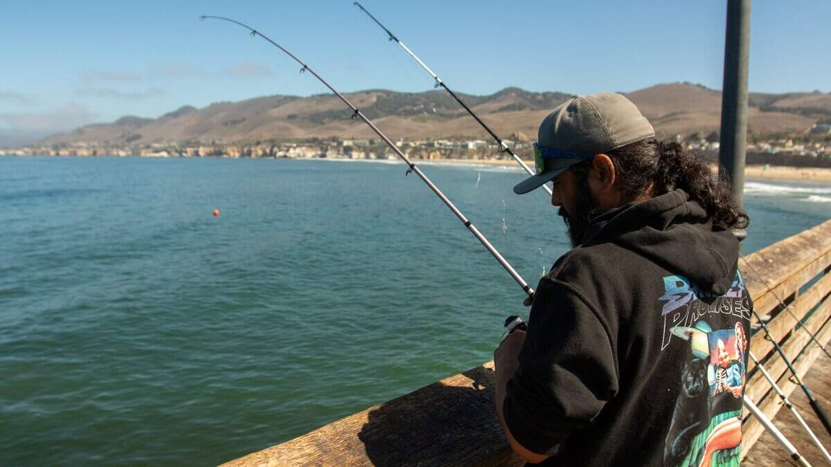Santa Maria resident Anthony Pinedo waits for bites off of the Pismo Beach Pier on July 8, 2026, hoping to pull in a thresher shark. He said smoked shark is his favorite snack.