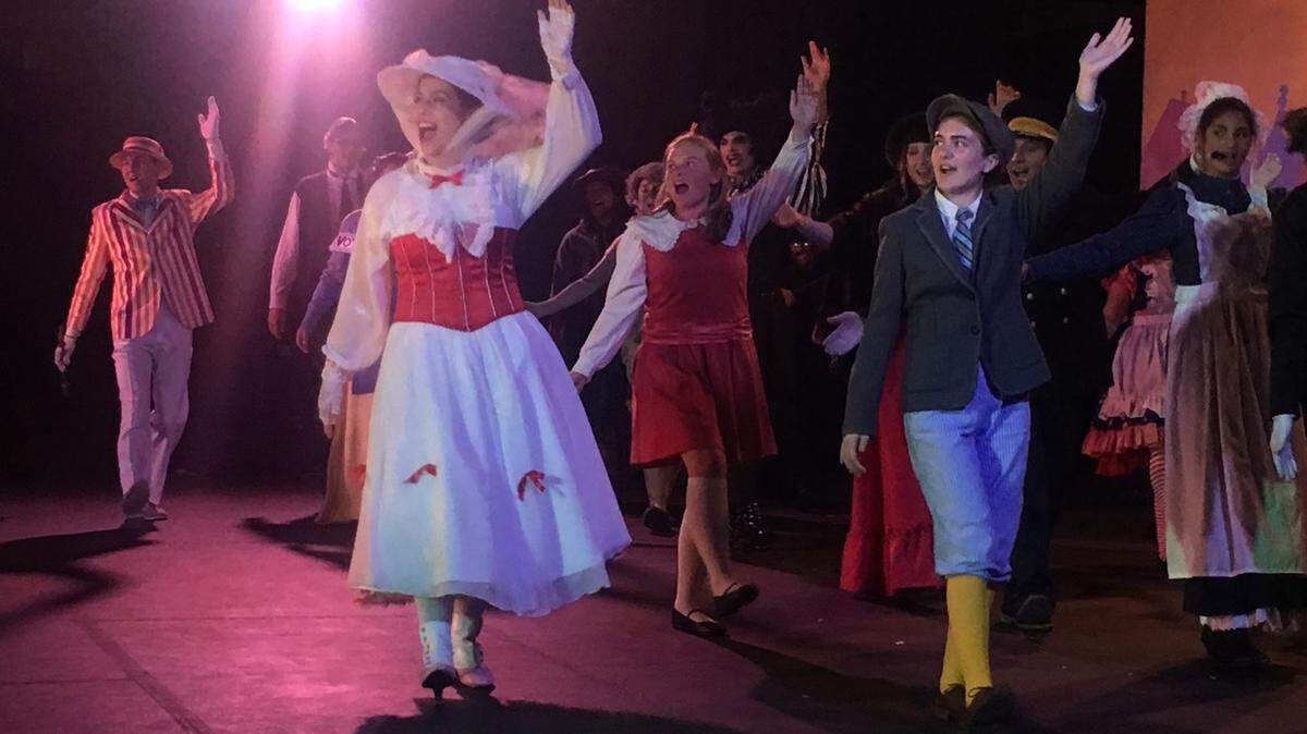 Left to right in front:  Bert (Ethan Walters), Mary Poppins (Hayley Zinnia’s), Jane (Fiona Cloward) and Michael (Isabella Edwards) join the cast for the grand finale in Coast Union High School’s Drama Club production of “Mary Poppins” at the high school gymnasium.