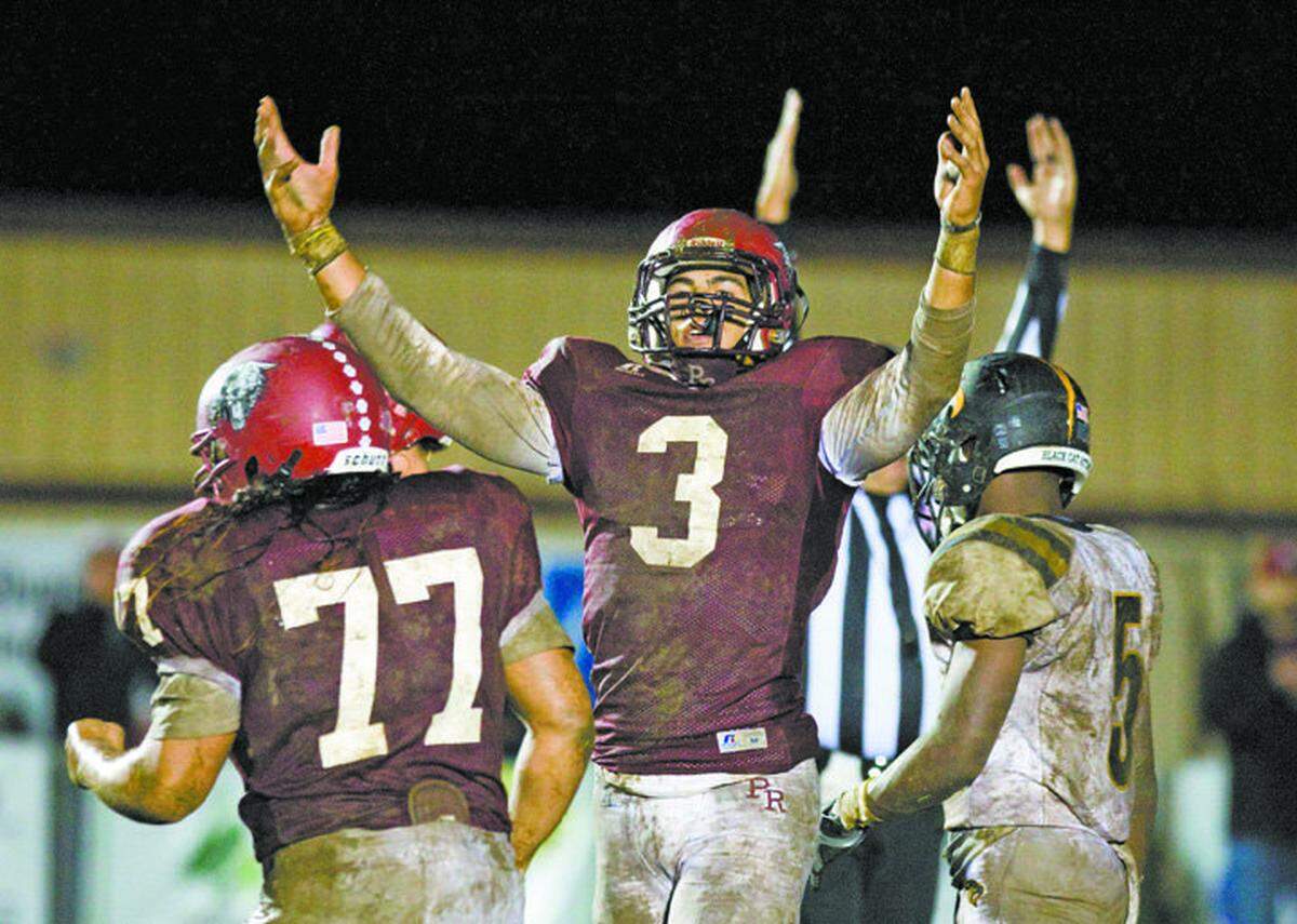 Paso Robles High’s Richards Flores (77), Josh Oliver (3) and the rest of the Bearcats have had plenty to celebrate in 2014, including a CIF-Southern Section Northern Division championship win over Newbury Park.